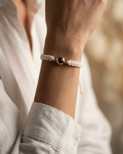 Close-up of a wrist wearing a bracelet with a blurred background