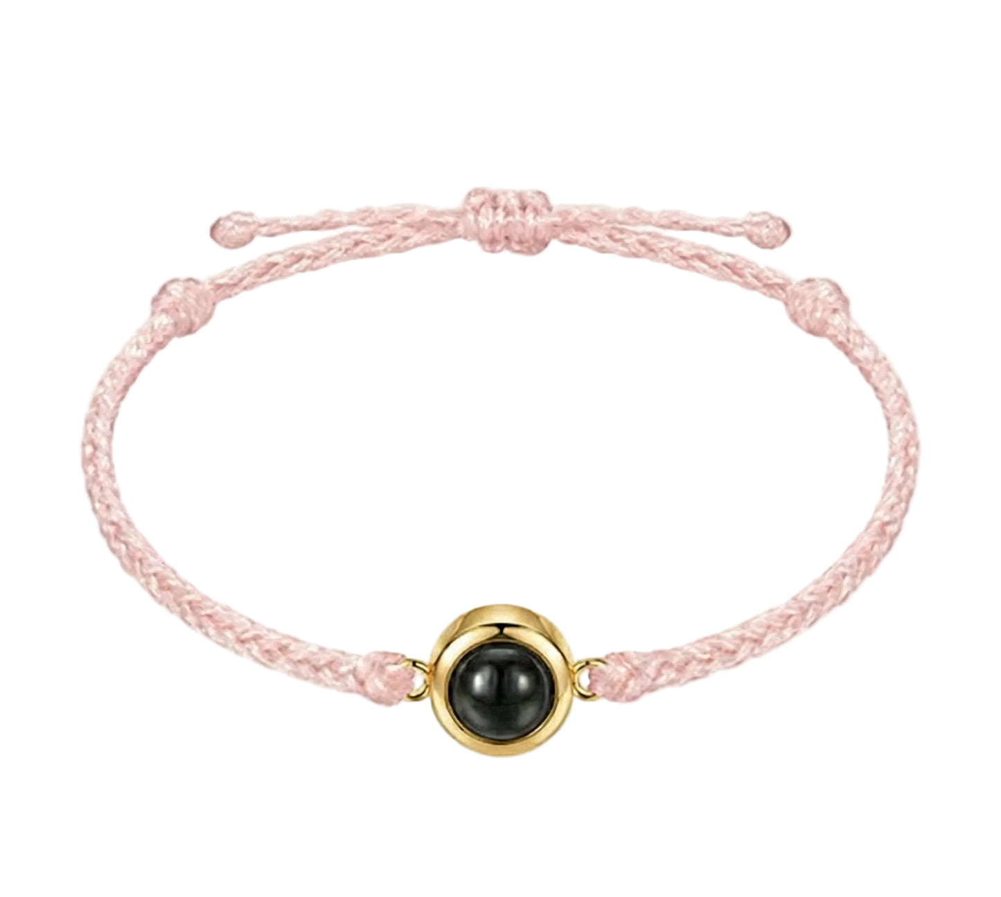 Pink braided bracelet with a black bead and gold accent on a white background
